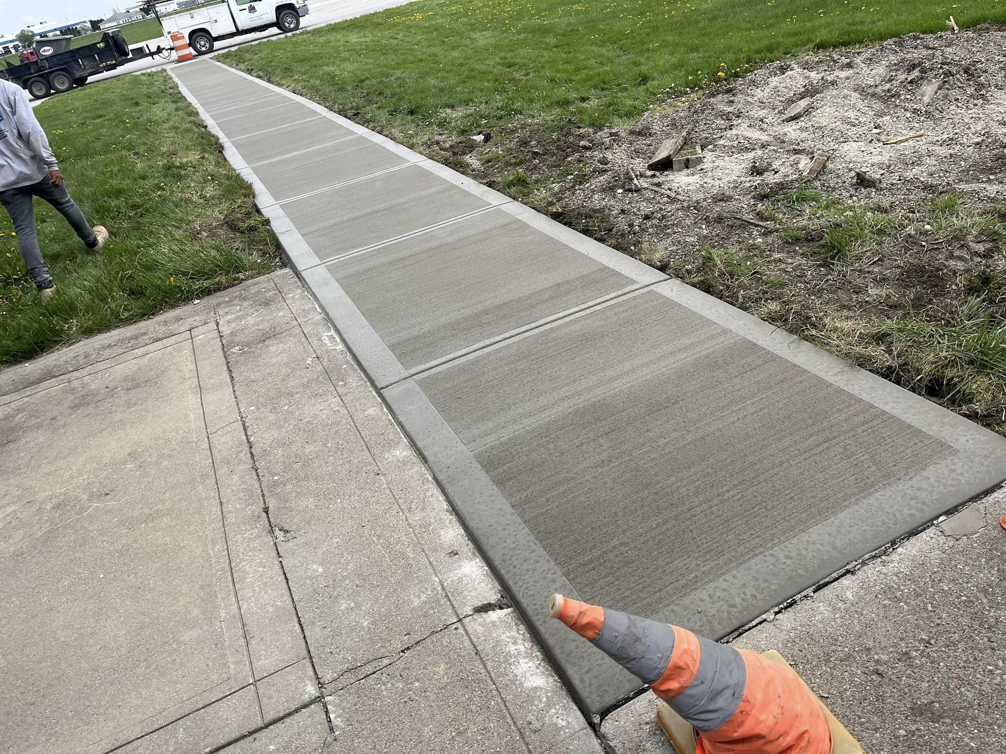 Newly constructed sidewalk showcasing expert craftsmanship and durability.